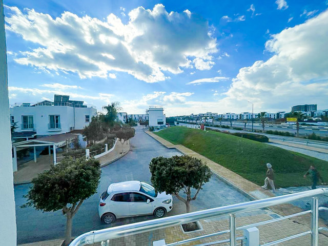Private garden of 3-bedroom villa with palm trees and greenery at Caesar Beach