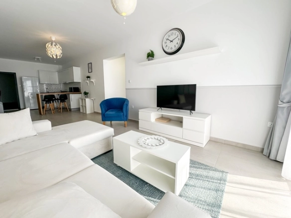 Modern, bright, and stylishly furnished 1-bedroom apartment in Caesar Resort, Long Beach — featuring open-plan layout, elegant furniture, large windows, and a spacious balcony.