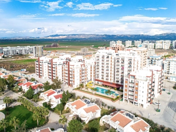 Modern 2-bedroom apartment in Long Beach, North Cyprus with sea views, fully furnished interiors, fitted kitchen, bright living room, two cozy bedrooms, and a private balcony overlooking the Mediterranean.