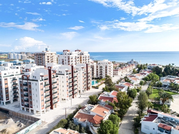 Modern 2-bedroom apartment in Long Beach, North Cyprus with sea views, fully furnished interiors, fitted kitchen, bright living room, two cozy bedrooms, and a private balcony overlooking the Mediterranean.