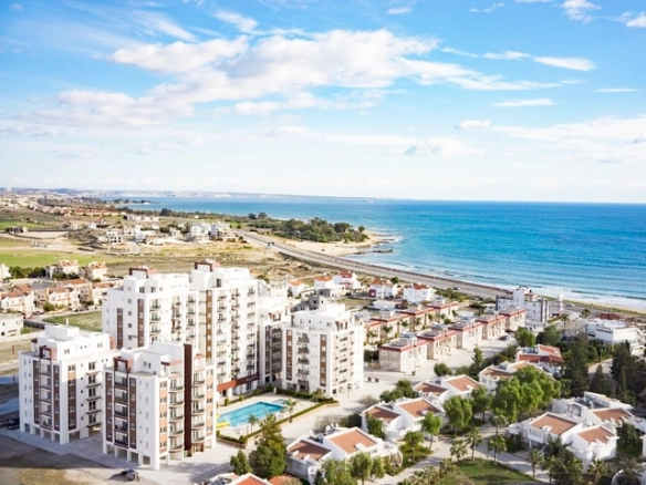 Modern 2-bedroom apartment in Long Beach, North Cyprus with sea views, fully furnished interiors, fitted kitchen, bright living room, two cozy bedrooms, and a private balcony overlooking the Mediterranean.