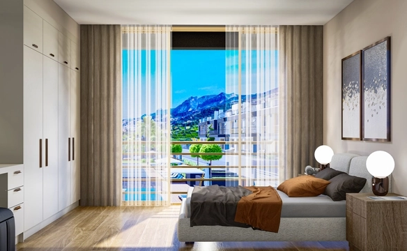Modern 1-bedroom garden apartment in Spectra Project Lapta featuring stylish interior design, open-plan kitchen, spacious living area, and scenic mountain and pool views in North Cyprus.