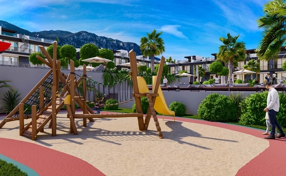 Modern 1-bedroom garden apartment in Spectra Project Lapta featuring stylish interior design, open-plan kitchen, spacious living area, and scenic mountain and pool views in North Cyprus.