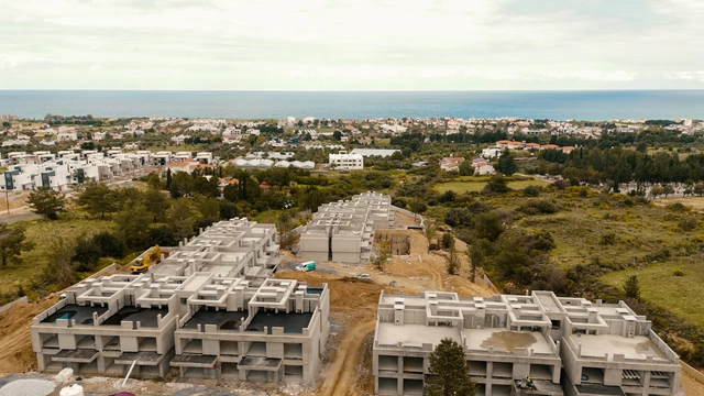 260220 spectra update.00_00_16_14.still009.jpg009 Modern townhouse Project in Lapta Kyrenia featuring stylish interior design, open-plan kitchen, spacious living area, and scenic mountain and pool views in North Cyprus.