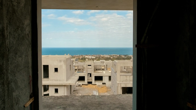 260220 spectra update.00_01_04_00.still044.jpg044 Modern townhouse Project in Lapta Kyrenia featuring stylish interior design, open-plan kitchen, spacious living area, and scenic mountain and pool views in North Cyprus.