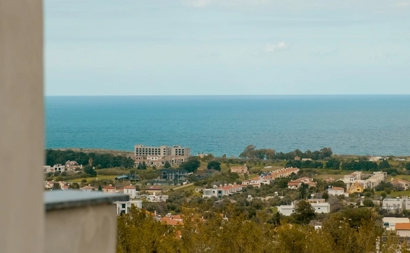 Modern townhouse Project in Lapta Kyrenia featuring stylish interior design, open-plan kitchen, spacious living area, and scenic mountain and pool views in North Cyprus.