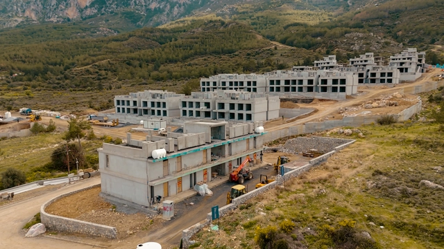 260220 spectra update.00_01_13_08.still054.jpg054 Modern townhouse Project in Lapta Kyrenia featuring stylish interior design, open-plan kitchen, spacious living area, and scenic mountain and pool views in North Cyprus.