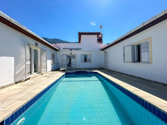 4-bedroom bungalow in Lapta Kyrenia with private swimming pool, garden, outdoor seating area, and detached single-level home with ready title deed in North Cyprus