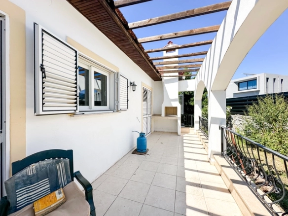 4-bedroom bungalow in Lapta Kyrenia with private swimming pool, garden, outdoor seating area, and detached single-level home with ready title deed in North Cyprus