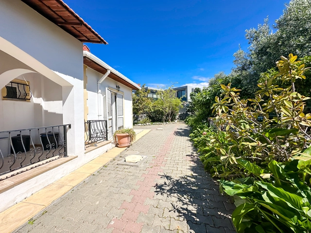 4-bedroom bungalow in Lapta Kyrenia with private swimming pool, garden, outdoor seating area, and detached single-level home with ready title deed in North Cyprus