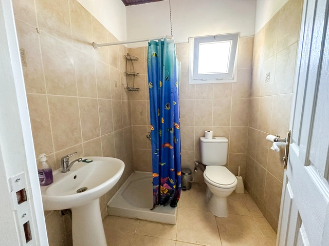 4-bedroom bungalow in Lapta Kyrenia with private swimming pool, garden, outdoor seating area, and detached single-level home with ready title deed in North Cyprus