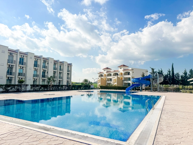 1 bedroom furnished apartment for sale in Boaz Iskele North Cyprus near Long Beach with pool complex.