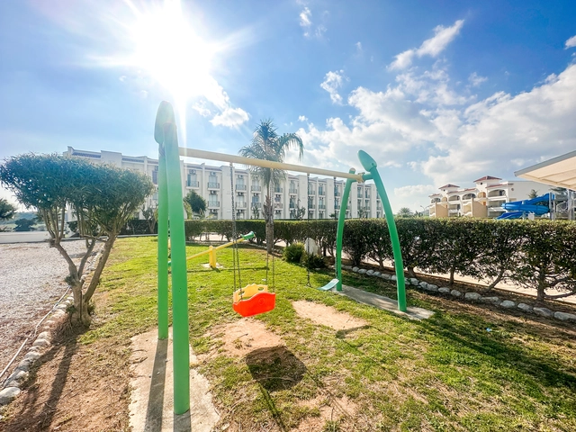 1 bedroom furnished apartment for sale in Boaz Iskele North Cyprus near Long Beach with pool complex.