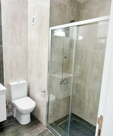 Fully furnished 1-bedroom apartment in Park Residence Long Beach with modern open-plan kitchen, bright living room, spacious balcony, and ready-to-move-in condition in North Cyprus