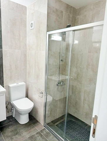 Fully furnished 1-bedroom apartment in Park Residence Long Beach with modern open-plan kitchen, bright living room, spacious balcony, and ready-to-move-in condition in North Cyprus