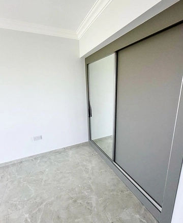 Fully furnished 1-bedroom apartment in Park Residence Long Beach with modern open-plan kitchen, bright living room, spacious balcony, and ready-to-move-in condition in North Cyprus