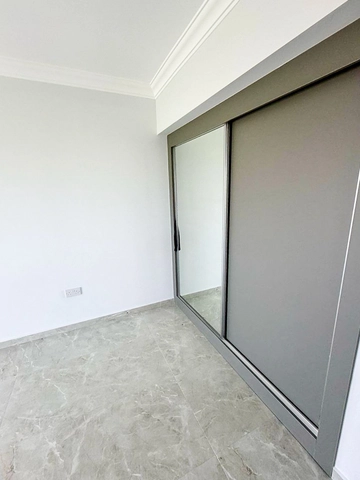 Fully furnished 1-bedroom apartment in Park Residence Long Beach with modern open-plan kitchen, bright living room, spacious balcony, and ready-to-move-in condition in North Cyprus