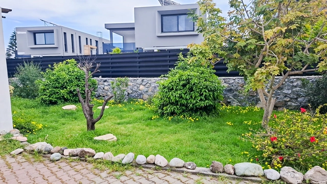 4-bedroom bungalow in Lapta Kyrenia with private swimming pool, garden, outdoor seating area, and detached single-level home with ready title deed in North Cyprus