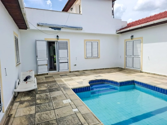 4-bedroom bungalow in Lapta Kyrenia with private swimming pool, garden, outdoor seating area, and detached single-level home with ready title deed in North Cyprus