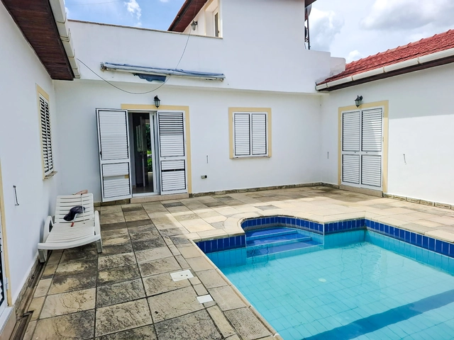 4-bedroom bungalow in Lapta Kyrenia with private swimming pool, garden, outdoor seating area, and detached single-level home with ready title deed in North Cyprus