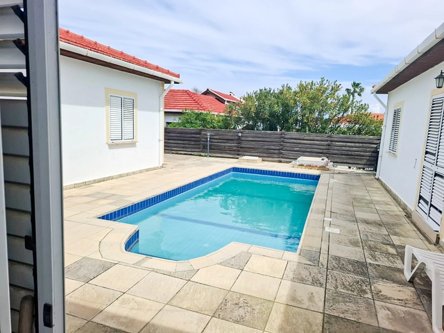 4-bedroom bungalow in Lapta Kyrenia with private swimming pool, garden, outdoor seating area, and detached single-level home with ready title deed in North Cyprus