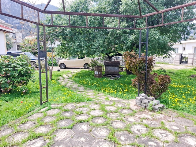 4-bedroom bungalow in Lapta Kyrenia with private swimming pool, garden, outdoor seating area, and detached single-level home with ready title deed in North Cyprus