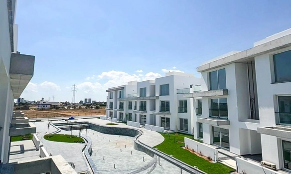 Loft townhouse apartment in Olive Court Yeni Boğaziçi with duplex layout, modern interior, large terrace, high ceilings, and bright open-plan living space in North Cyprus