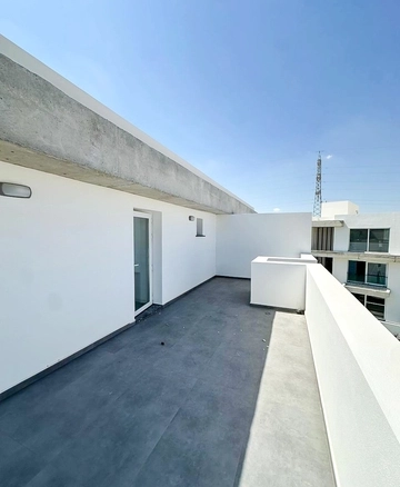 Loft townhouse apartment in Olive Court Yeni Boğaziçi with duplex layout, modern interior, large terrace, high ceilings, and bright open-plan living space in North Cyprus