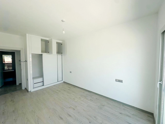 Loft townhouse apartment in Olive Court Yeni Boğaziçi with duplex layout, modern interior, large terrace, high ceilings, and bright open-plan living space in North Cyprus