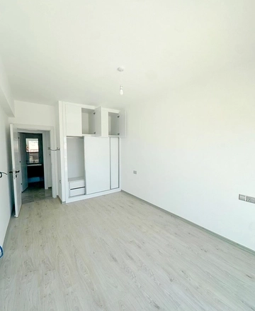 Loft townhouse apartment in Olive Court Yeni Boğaziçi with duplex layout, modern interior, large terrace, high ceilings, and bright open-plan living space in North Cyprus