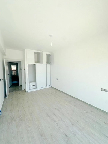 Loft townhouse apartment in Olive Court Yeni Boğaziçi with duplex layout, modern interior, large terrace, high ceilings, and bright open-plan living space in North Cyprus