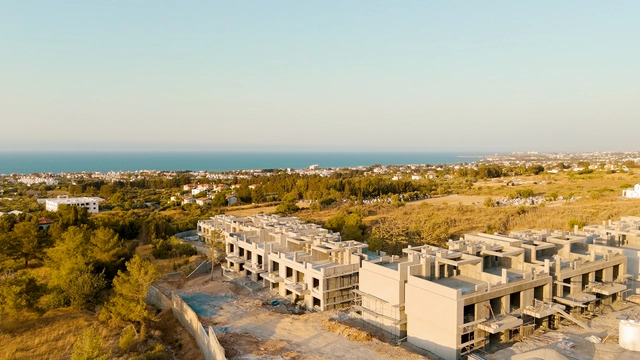 Modern townhouse Project in Lapta Kyrenia featuring stylish interior design, open-plan kitchen, spacious living area, and scenic mountain and pool views in North Cyprus.