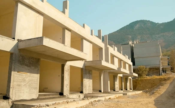 Modern townhouse Project in Lapta Kyrenia featuring stylish interior design, open-plan kitchen, spacious living area, and scenic mountain and pool views in North Cyprus.