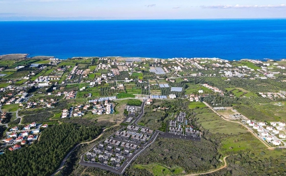 Modern 1-bedroom garden apartment in Spectra Project Lapta featuring stylish interior design, open-plan kitchen, spacious living area, and scenic mountain and pool views in North Cyprus.