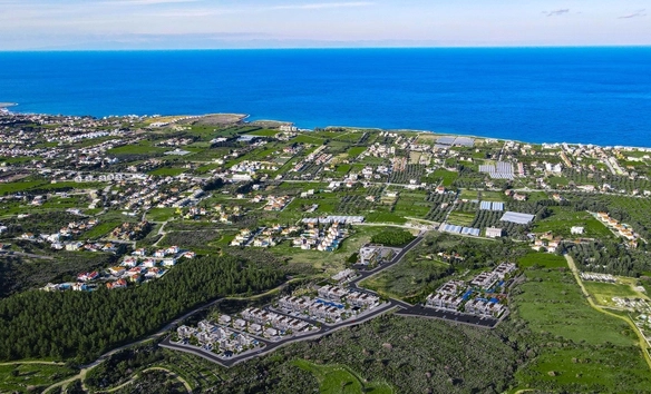 Modern 1-bedroom garden apartment in Spectra Project Lapta featuring stylish interior design, open-plan kitchen, spacious living area, and scenic mountain and pool views in North Cyprus.