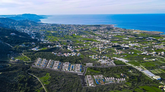 spectra drone (3).jpg3 Modern 1-bedroom garden apartment in Spectra Project Lapta featuring stylish interior design, open-plan kitchen, spacious living area, and scenic mountain and pool views in North Cyprus.