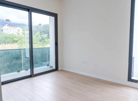 Three-bedroom semi-detached duplex villa with communal pool in Alsancak Yeşiltepe, Kyrenia, North Cyprus.