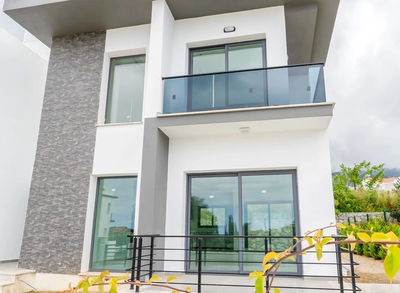 Three-bedroom semi-detached duplex villa with communal pool in Alsancak Yeşiltepe, Kyrenia, North Cyprus.