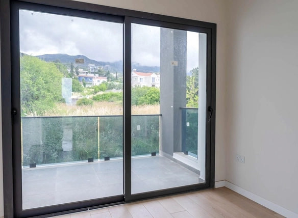 Three-bedroom semi-detached duplex villa with communal pool in Alsancak Yeşiltepe, Kyrenia, North Cyprus.