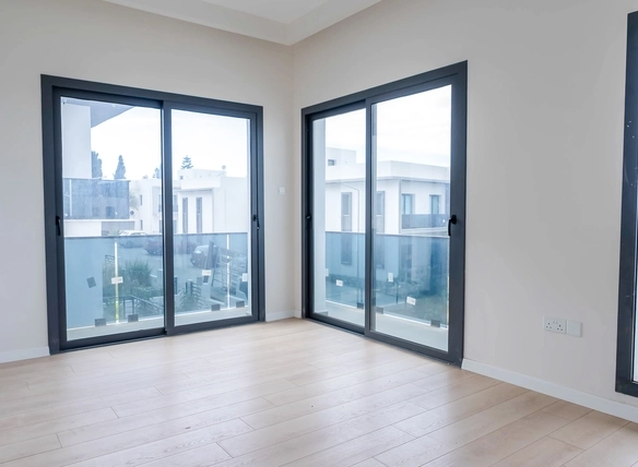 Three-bedroom semi-detached duplex villa with communal pool in Alsancak Yeşiltepe, Kyrenia, North Cyprus.
