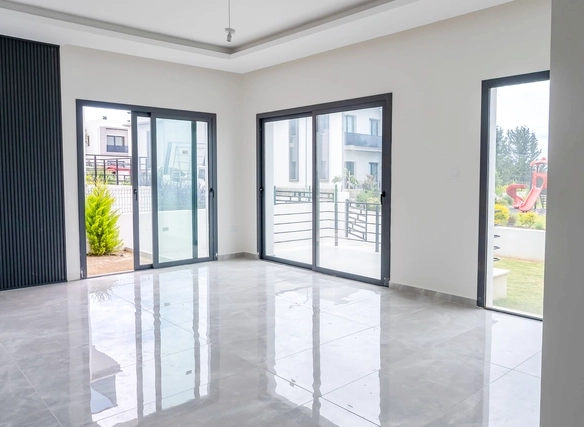 Three-bedroom semi-detached duplex villa with communal pool in Alsancak Yeşiltepe, Kyrenia, North Cyprus.