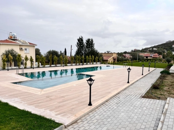 Three-bedroom semi-detached duplex villa with communal pool in Alsancak Yeşiltepe, Kyrenia, North Cyprus.